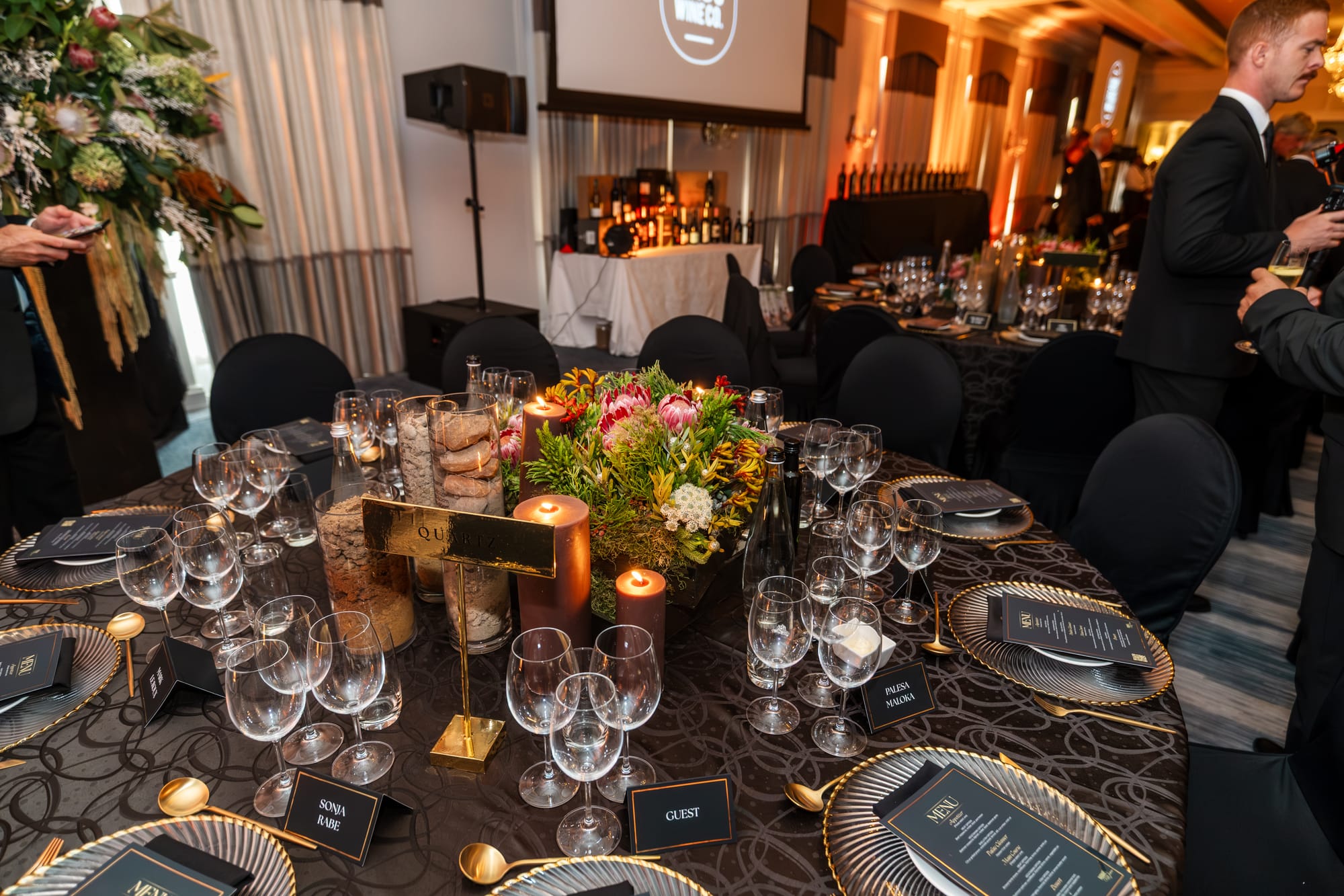 A gala table dressed with proteas and candles