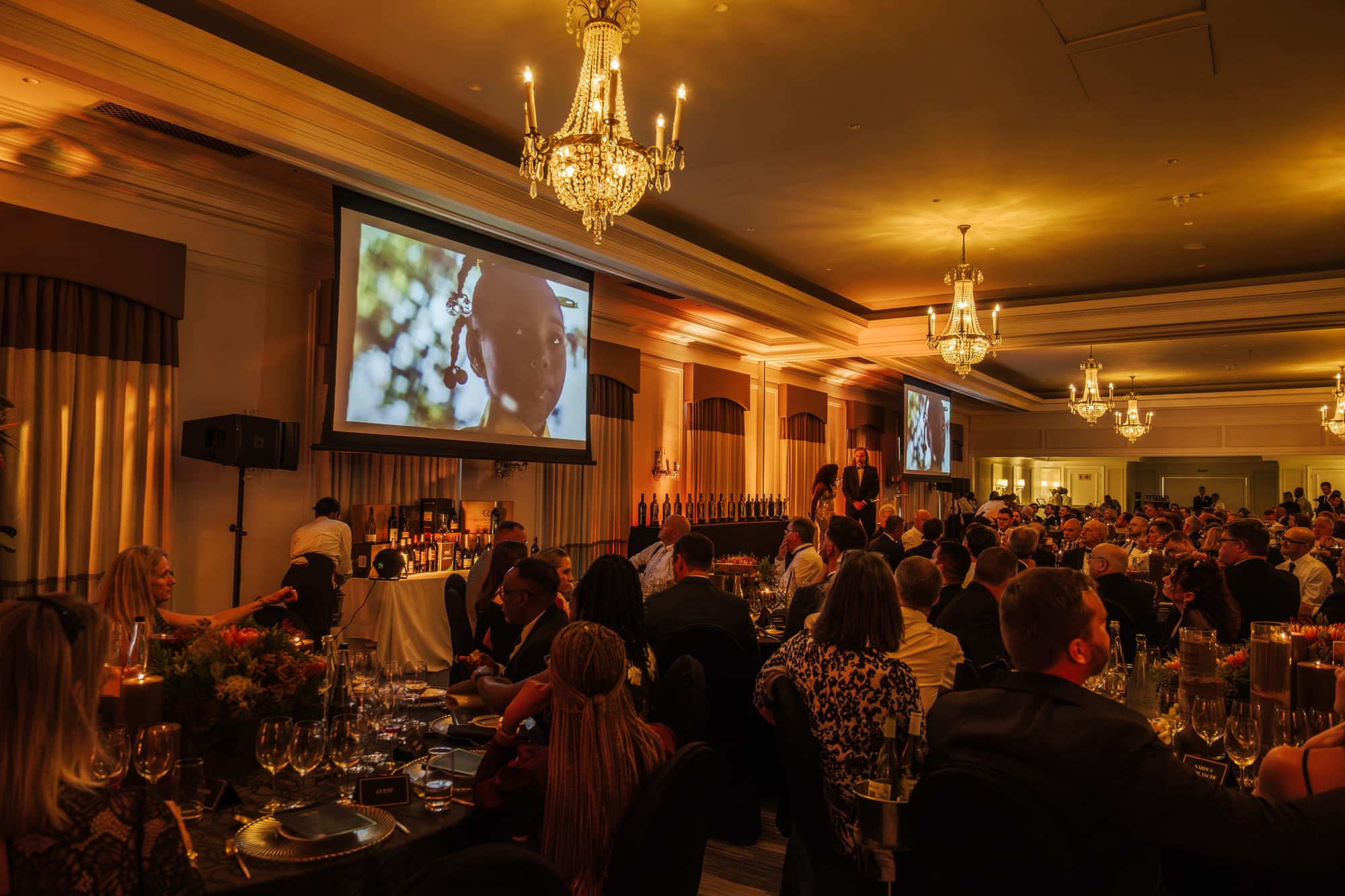 The candlelit ballroom during the awards dinner