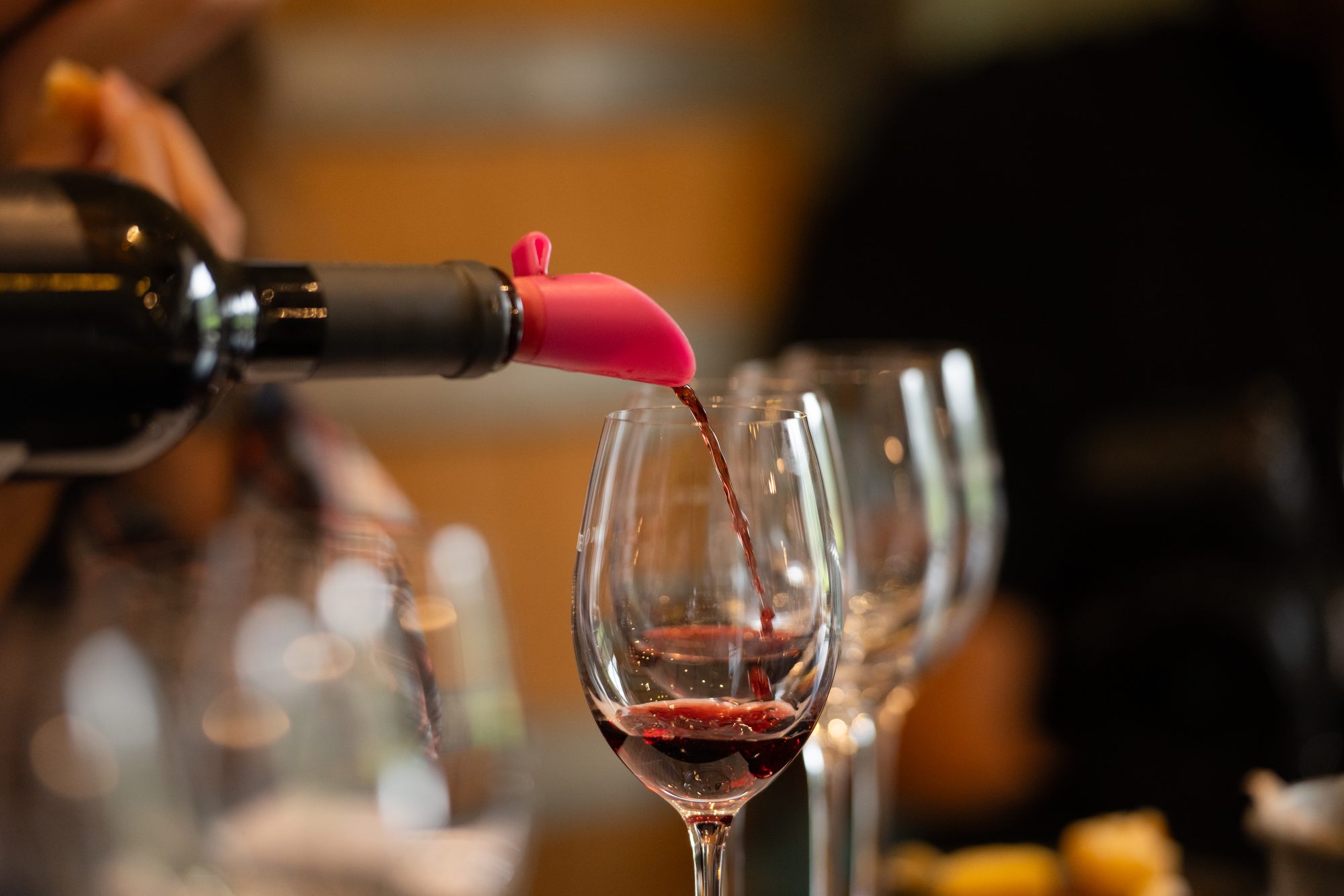 A red wine being poured at the tasting table